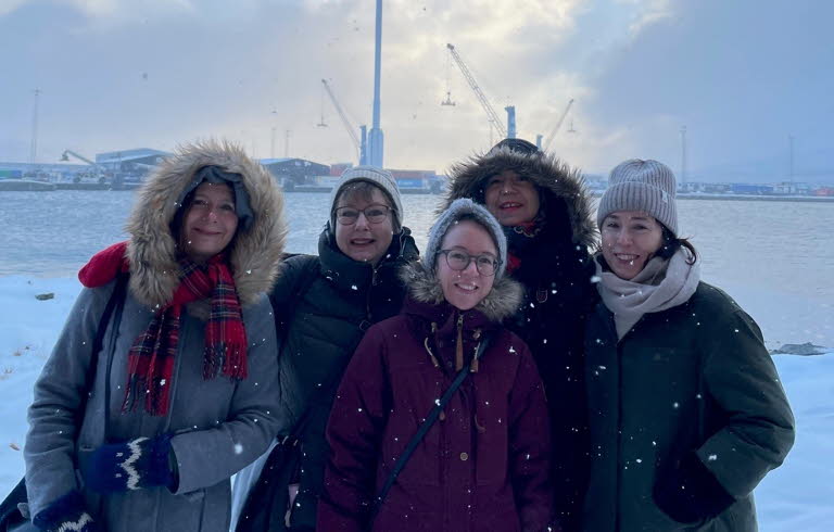 Group picture of us five women who work with Swedish Literature Exchange. The picture was taken outdoors, it is snowing and we are wearing thick jackets.