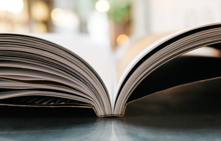 Photo, close up on the side of an open book.