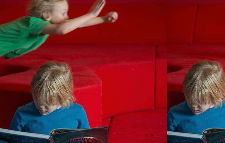 Ett läsande och ett flygande barn i bakgrunden