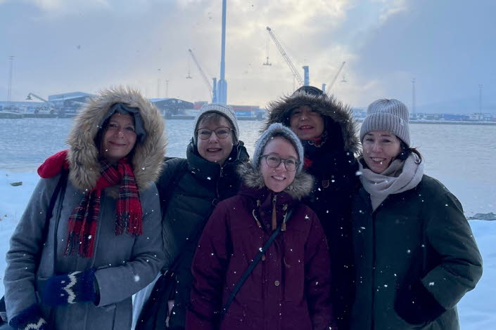 Group picture of us five women who work with Swedish Literature Exchange. The picture was taken outdoors, it is snowing and we are wearing thick jackets.