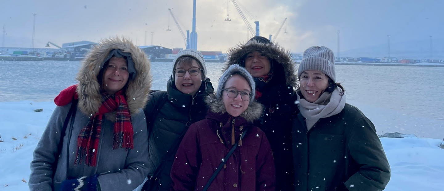 Group picture of us five women who work with Swedish Literature Exchange. The picture was taken outdoors, it is snowing and we are wearing thick jackets.