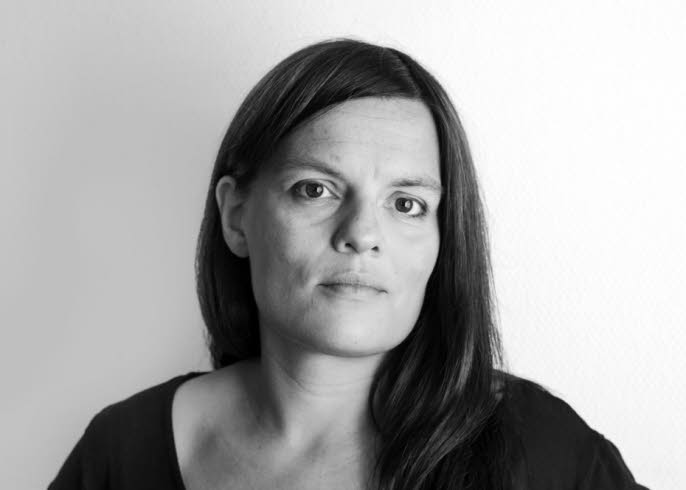 Portrait of Kristina Lindquist, it's black and white and she's looking towards the camera.