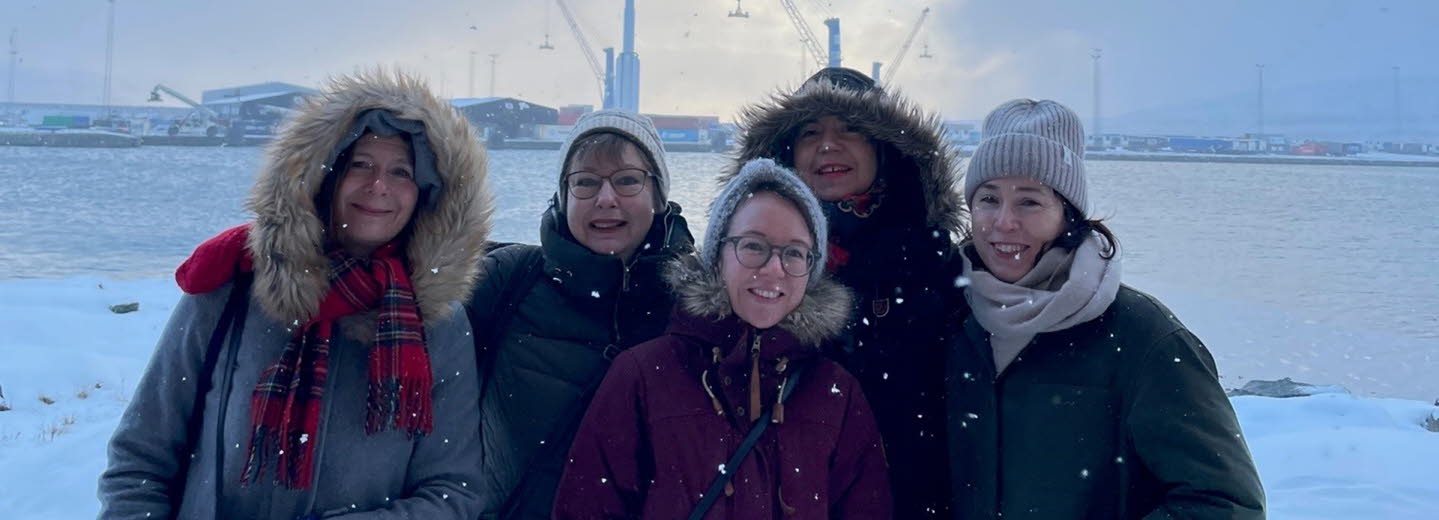 Group picture of us five women who work with Swedish Literature Exchange. The picture was taken outdoors, it is snowing and we are wearing thick jackets.