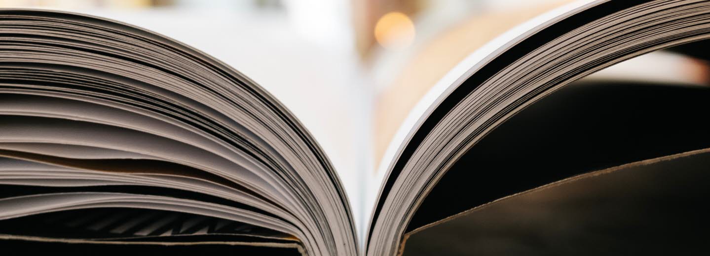 Photo, close up on the side of an open book.