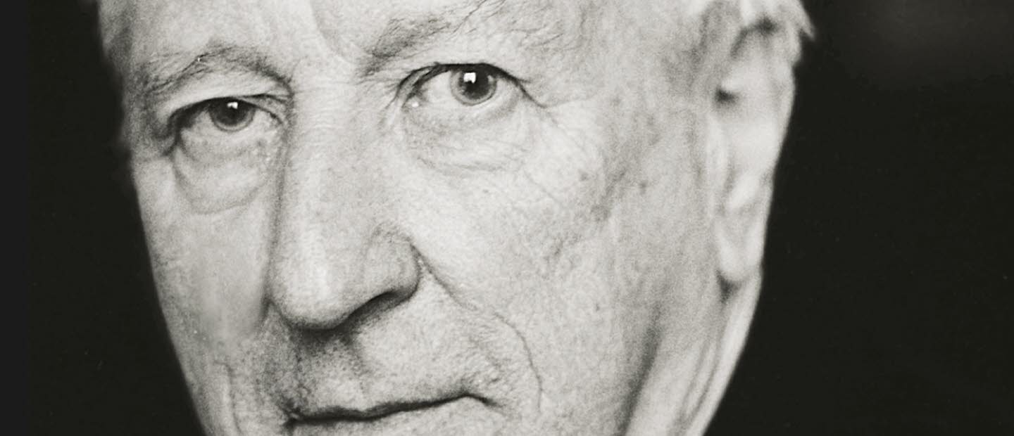 Book cover: A  black and white portrait of a man in a white shirt and black suit.