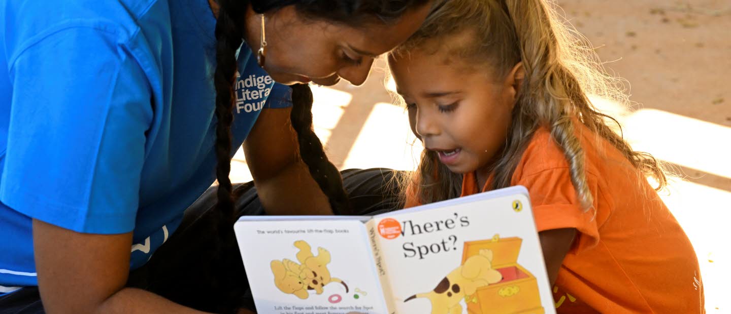 Woman reading for a young child