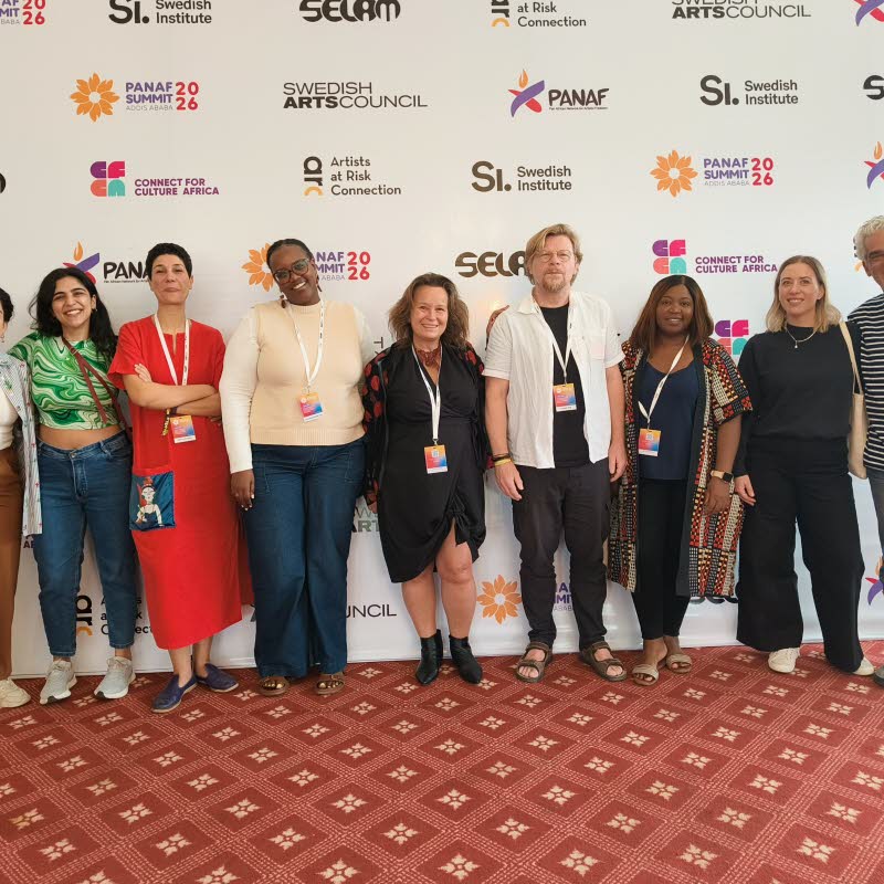 Group photo of smiling partners, Programme for Artistic Freedom. 