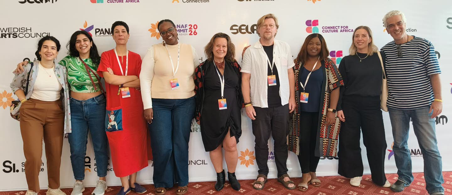 Group photo of smiling partners, Programme for Artistic Freedom. 