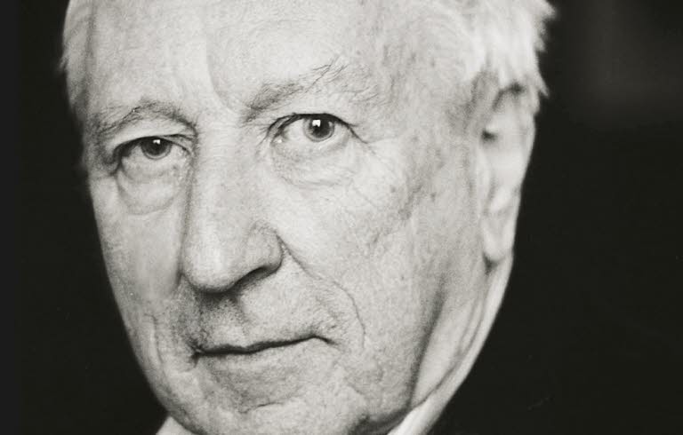 Book cover: A  black and white portrait of a man in a white shirt and black suit.