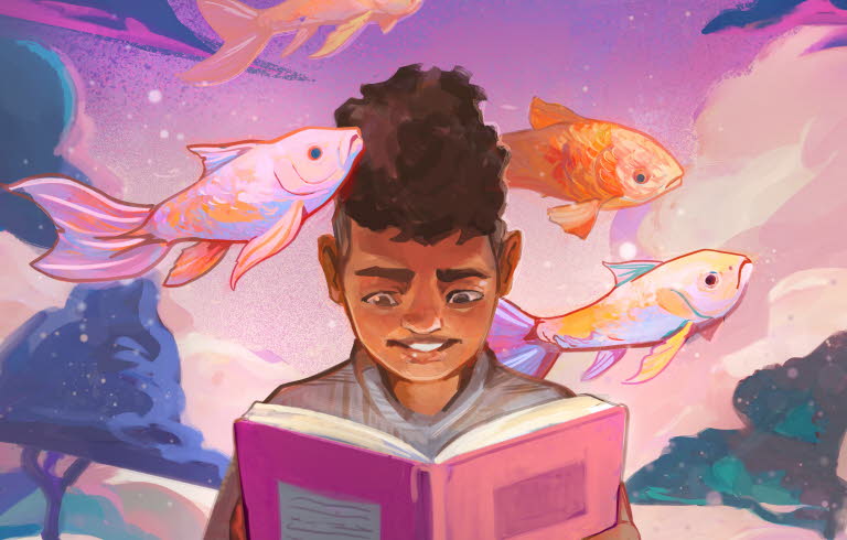 Pojke läser bok om fiskar.